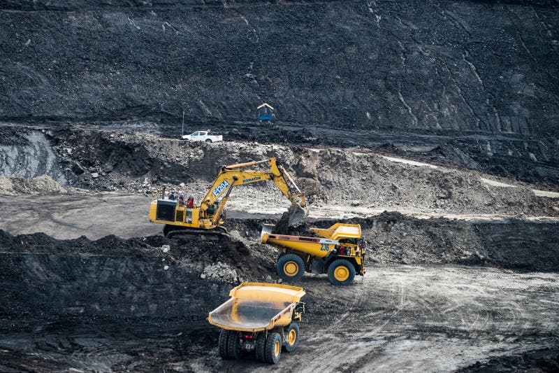 Loading coal into body truck. Mining truck mining machinery,to transport coal. stock photo