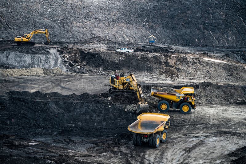 Loading coal into body truck. Mining truck mining machinery,to transport coal. royalty free stock photos