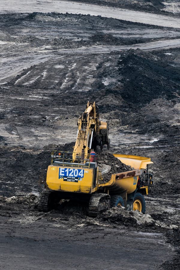 Loading coal into body truck. Mining truck mining machinery,to transport coal. Indonesia coal mining. stock photos