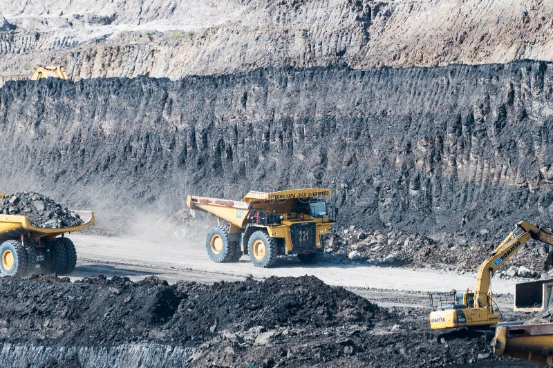 Loading coal into body truck. Mining truck mining machinery,to transport coal. royalty free stock images