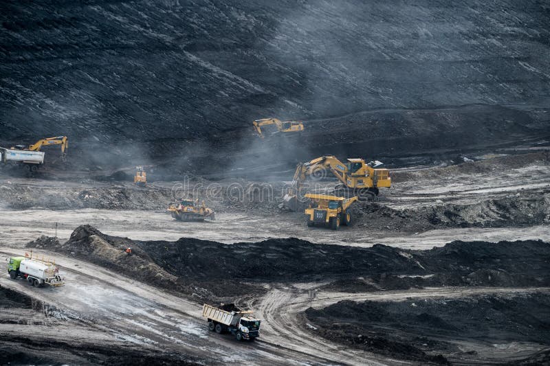 Loading coal into body truck. Mining truck mining machinery,to transport coal. royalty free stock photography