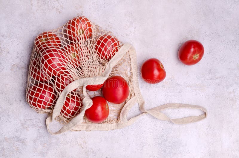 Large Raw Red Tomatoes in a Mesh Bag Stock Photo Image of background