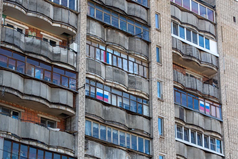 large russian apartment building balcony windows russian tricolor flags old dirty large russian apartment building balcony 212000239