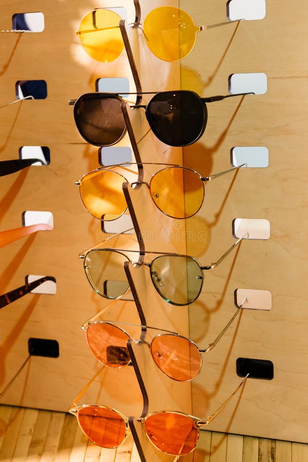 Large Selection of Sunglasses and Glasses on a Stand Stock Image