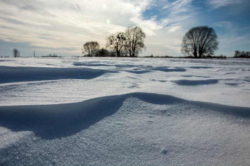 Large snow dune on a winter sunny day stock photo