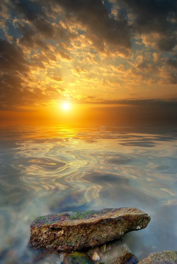 Large stone, sea, sunset