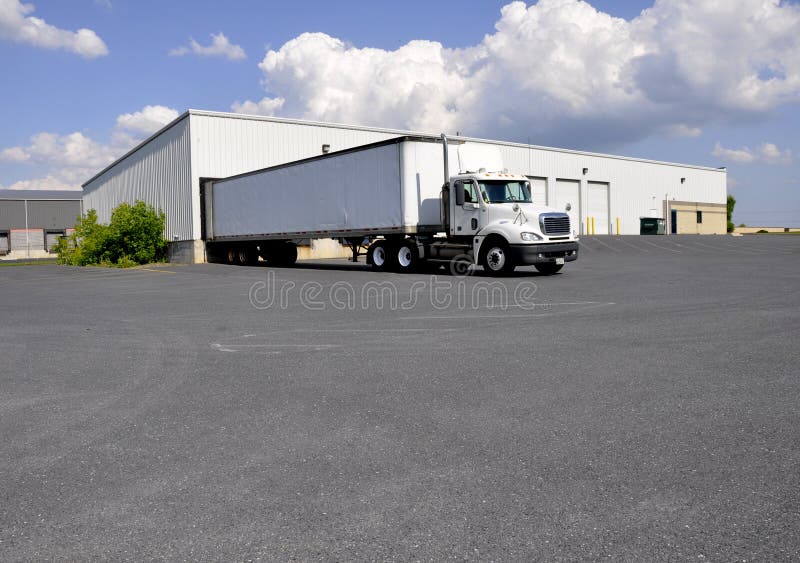 Large truck at unloading dock stock photography