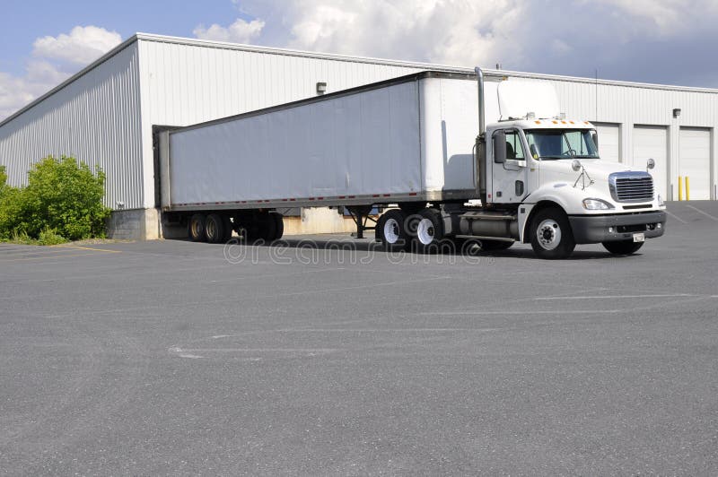 Large truck at unloading dock stock image