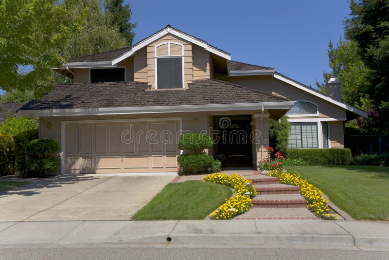 Large Two-Story Home with Pretty Landscaping royalty free stock photos