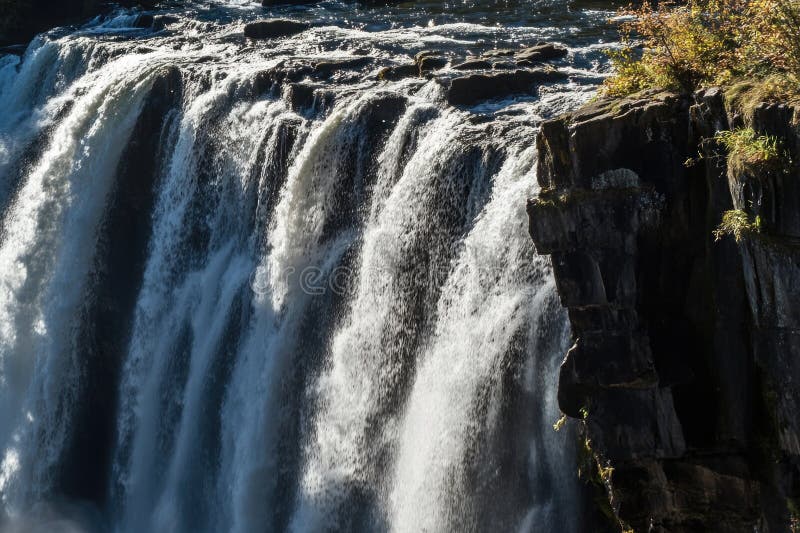 A large waterfall with abundant water flow royalty free stock images