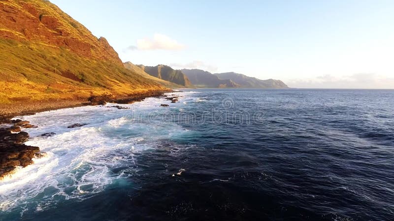 Large waves roll into the north west coast of Oahu