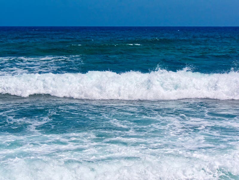 Large white horse ocean wave breaking on shore of sand stock photo Large white horse ocean wave breaking on shore of sand stock photo