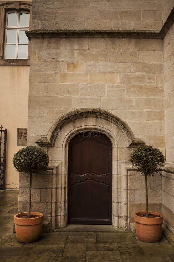 a large wooden door closed an old fortress in the stone wall of the castle in germany on the rhine river