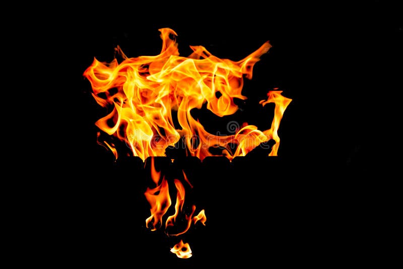 Las llamas del fuego en un fondo negro foto de archivo Las llamas del fuego en un fondo negro foto de archivo