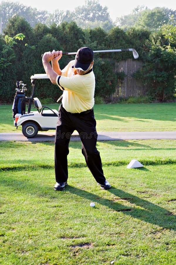 Backswing at the first tee. Backswing at the first tee.