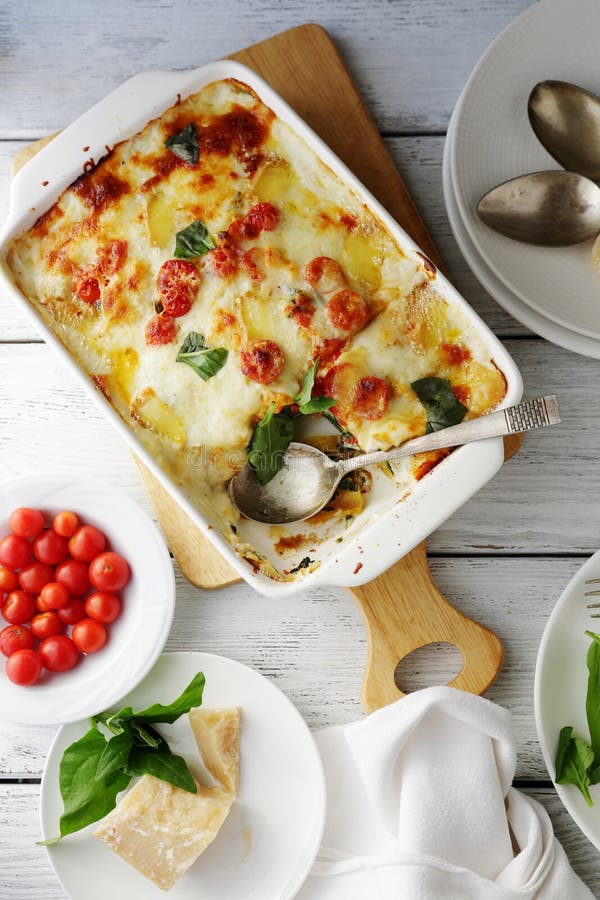 Lasagna in baking dish stock photo. Image of bolognese 65671388