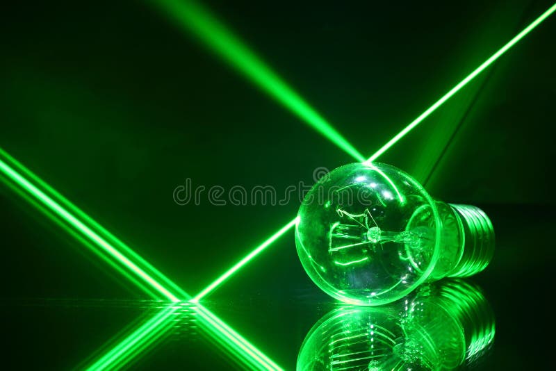 Laser beams and a lamp lying on the with mirror green