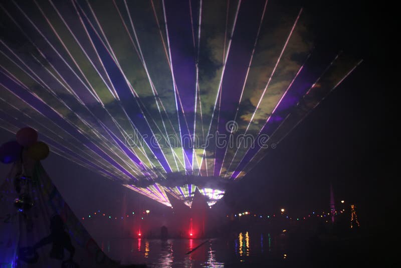 Laser beams during a public show in several colors at the water of the Ringvaart in Nieuwerkerk aan den IJssel stock photography Laser beams during a public show in several colors at the water of the Ringvaart in Nieuwerkerk aan den IJssel stock photography