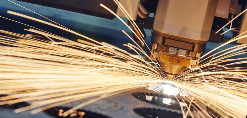 Laser cutting. Metal machining with sparks royalty free stock photo