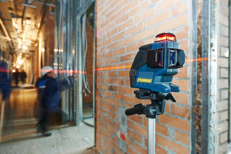 Laser level equipment in measurement work at indoor construction site. Laser level equipment in measurement work at indoor construction site