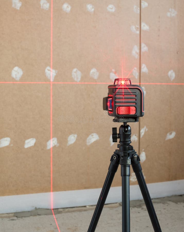 Laser level measuring tool in construction site.