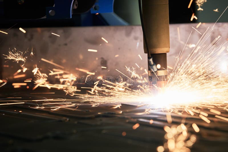 Laser or Plasma Cutting of Metal Sheet with Sparks Stock Photo Image