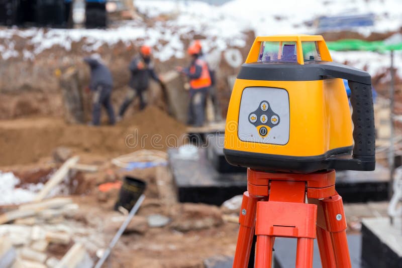 Laser Rangefinder at a Construction Site. Measuring Tool at a