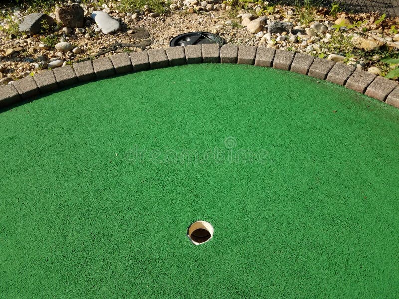 Last Hole on a Miniature Golf Course with Pipe To Ball Collection Bucket  Stock Image - Image of bucket, playing: 155694939
