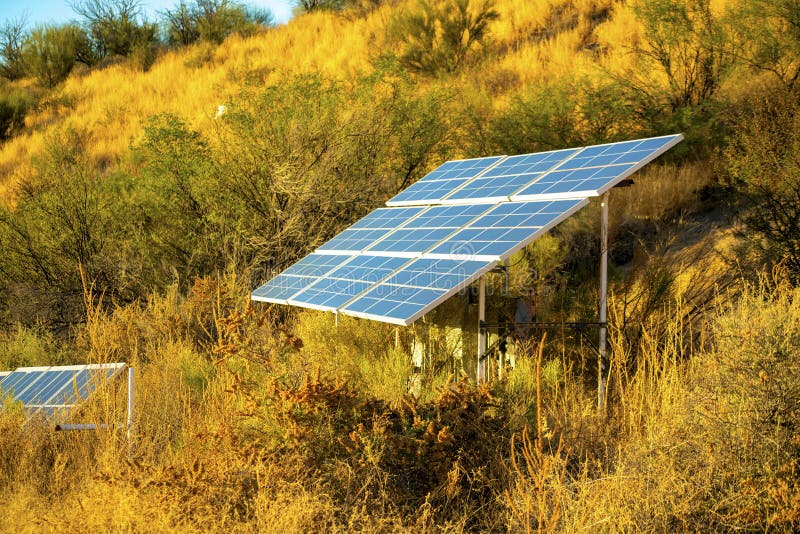 Late afternoon evening solar pannels in the hills and vegetation of arizona in wild west great outdoors with shrubs