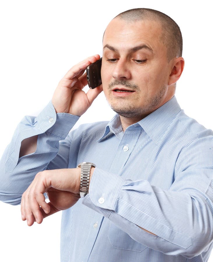 Late businessman looking at watch royalty free stock images Late businessman looking at watch royalty free stock images