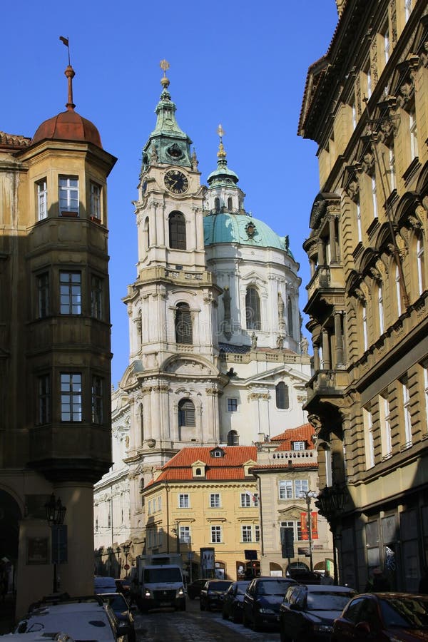 The late Snow in March Prague - view on St. Nicholas' Cathedral. The late Snow in March Prague - view on St. Nicholas' Cathedral