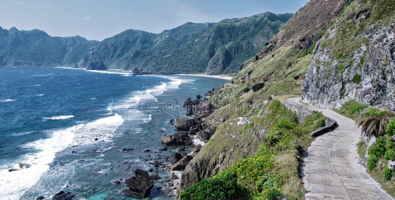 On the roof of the jeepney, looking at the scenic road which hugs the mountains and cliffs... all the way to the beach. On the roof of the jeepney, looking at the scenic road which hugs the mountains and cliffs... all the way to the beach.