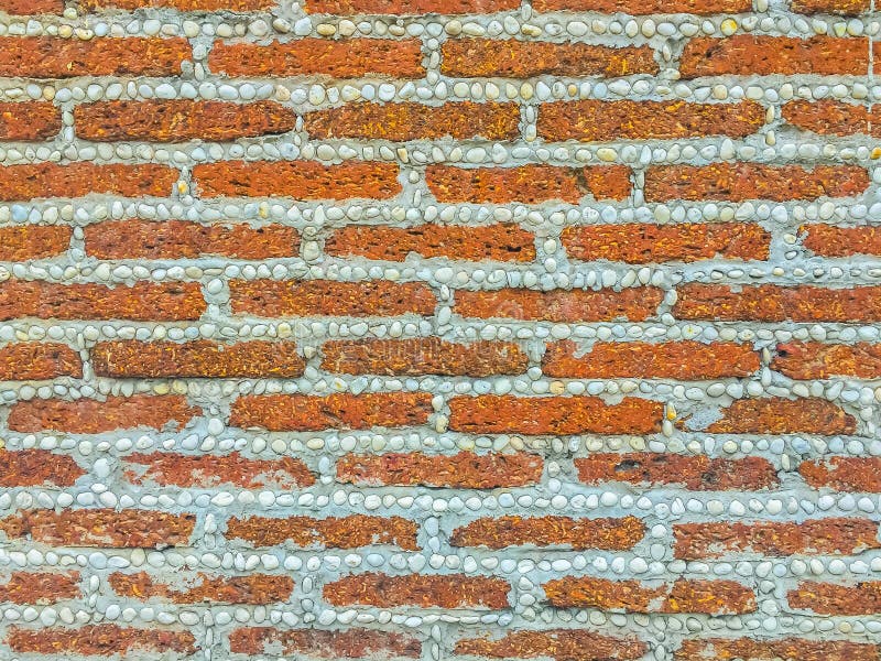 Laterite stone block and gravel dash pattern in the boundary fen. Ce wall. Laterite stone block wall pattern with gravel hyphen texture background stock images Laterite stone block and gravel dash pattern in the boundary fen. Ce wall. Laterite stone block wall pattern with gravel hyphen texture background stock images
