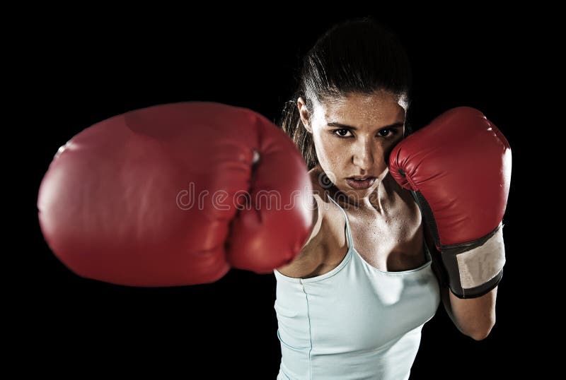 Latin fitness woman with girl red boxing gloves posing in defiant and competitive fight attitude