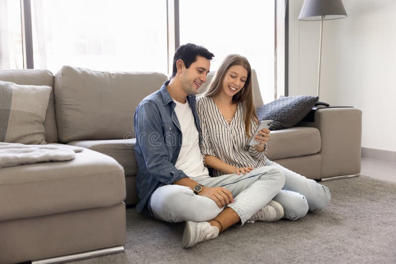 Latin spouses spend time on internet using smartphone stock image