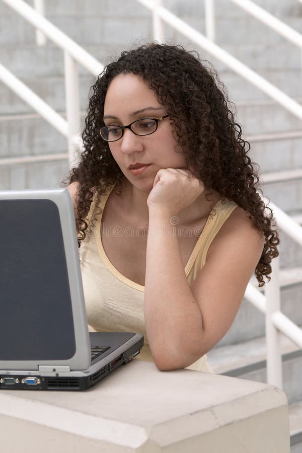 Latina Student At Computer Wearing Glasses Stock Photo 