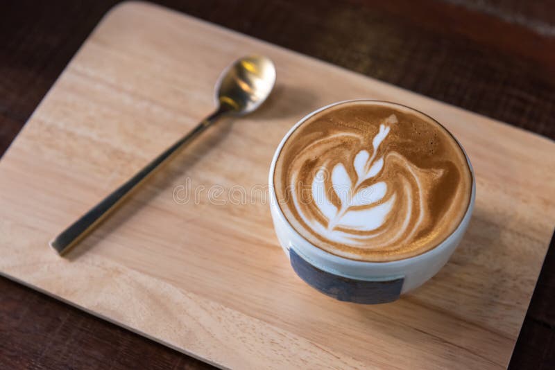 Latte art coffee cup heart shape topping and spoon stock images Latte art coffee cup heart shape topping and spoon stock images