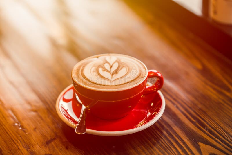 Latte art hot coffee on wooden table in the morning day royalty free stock image Latte art hot coffee on wooden table in the morning day royalty free stock image