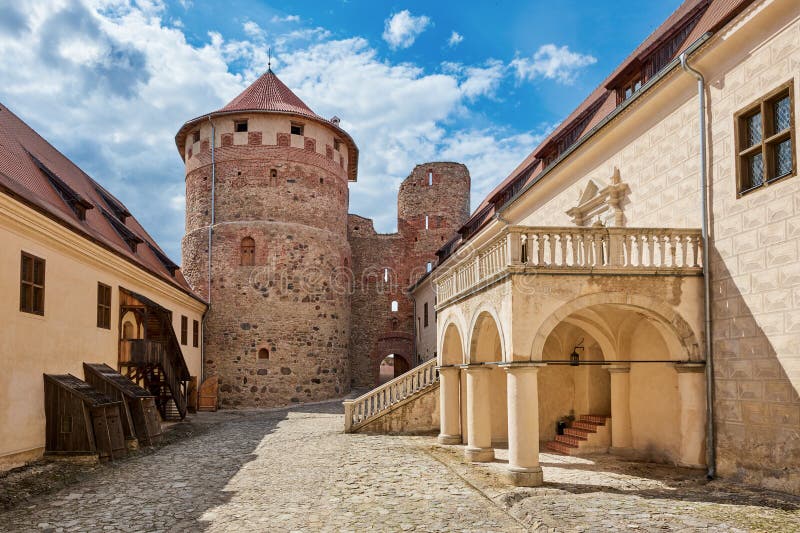 Latvian tourist landmark attraction. Medieval Bauska Castle courtyard. Ruins of medieval castle and the remains of a later palace