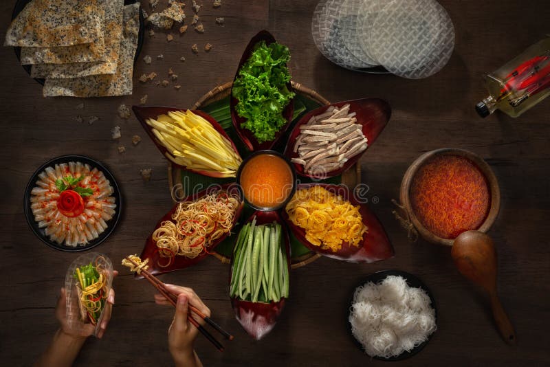 Lau. Hot pot with pork, banana flowers, mango, salted fish, scrambled eggs, rice noodles - Vietnamese cuisine.