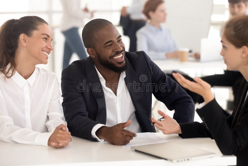 Laughing african american couple at meeting negotiation