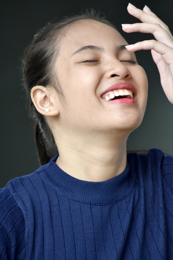 Laughing Asian Female Youngster royalty free stock image Laughing Asian Female Youngster royalty free stock image