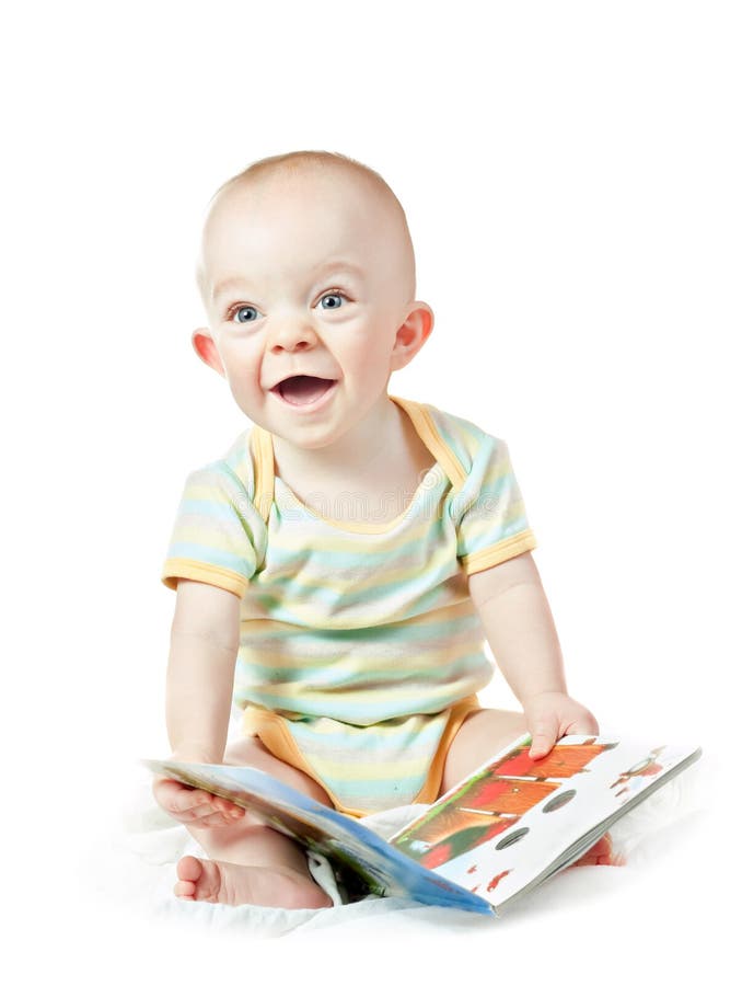 Laughing baby boy with book