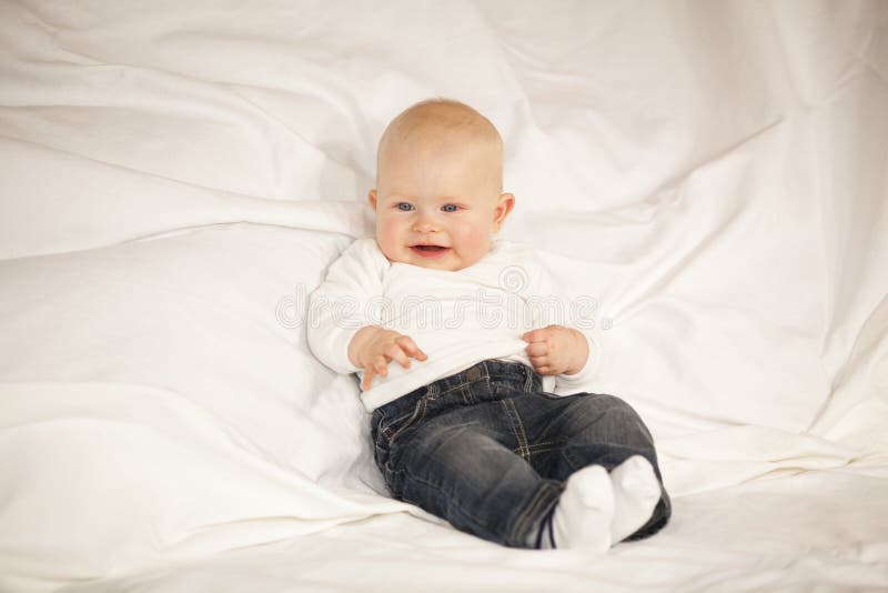 Laughing Baby Girl Sitting on a Couch Stock Image - Image of happiness ...