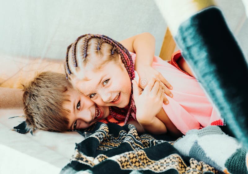 Sisters spending time in a tent on camping. Children using tablet playing games  online during summer vacation - a Royalty Free Stock Photo from Photocase