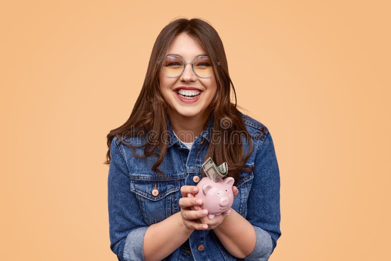 Laughing Chubby Woman Putting Money In Piggy Ban