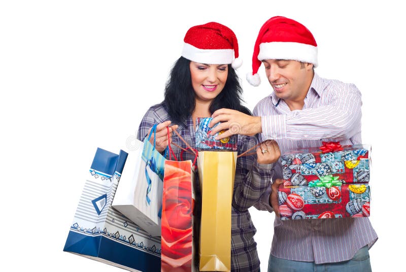 Laughing couple have fun with Christmas presents