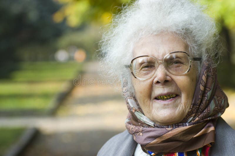 Laughing elderly woman in park royalty free stock images Laughing elderly woman in park royalty free stock images