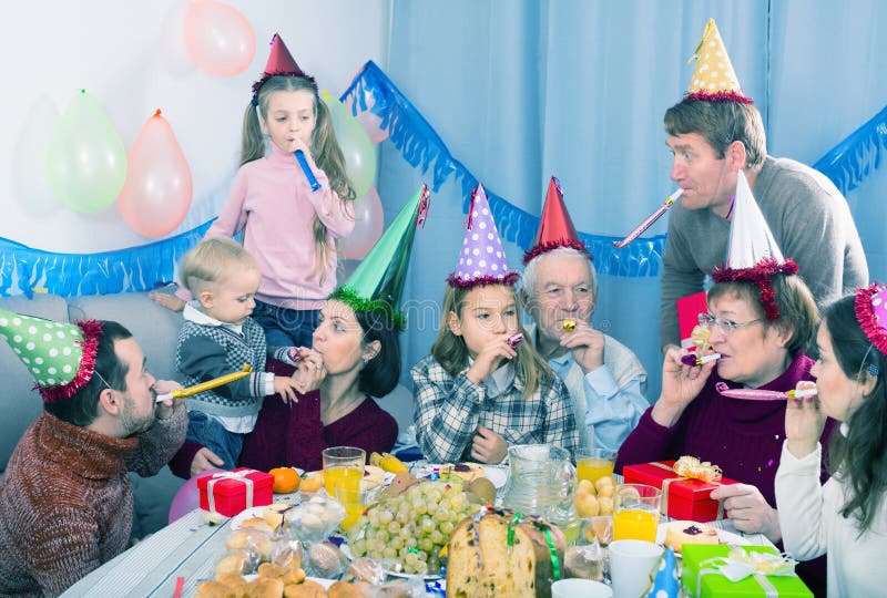 Laughing family behaving jokingly during party