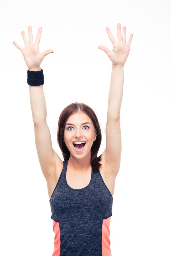Laughing fitness woman standing with raised hands up.